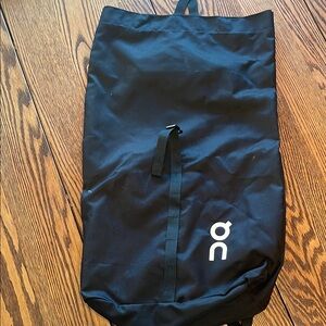 On Black Drawstring Bag